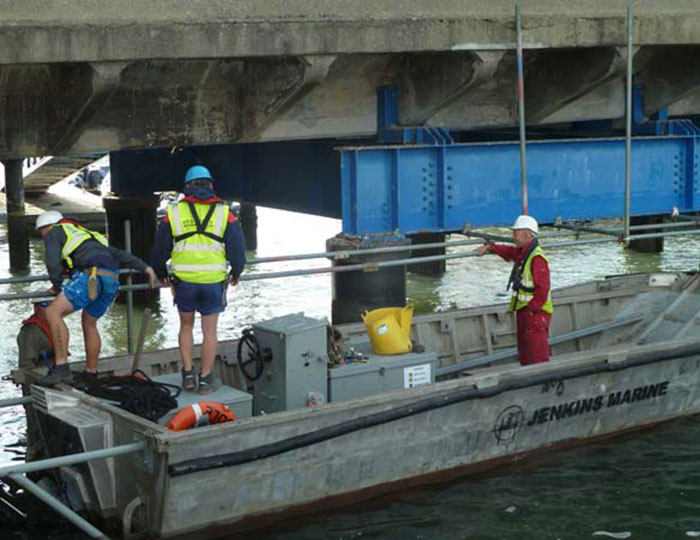 Marine scaffolding access beneath a dockside structure